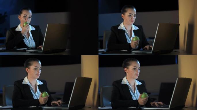 高清多莉: 女商人在工作到很晚的时候吃苹果