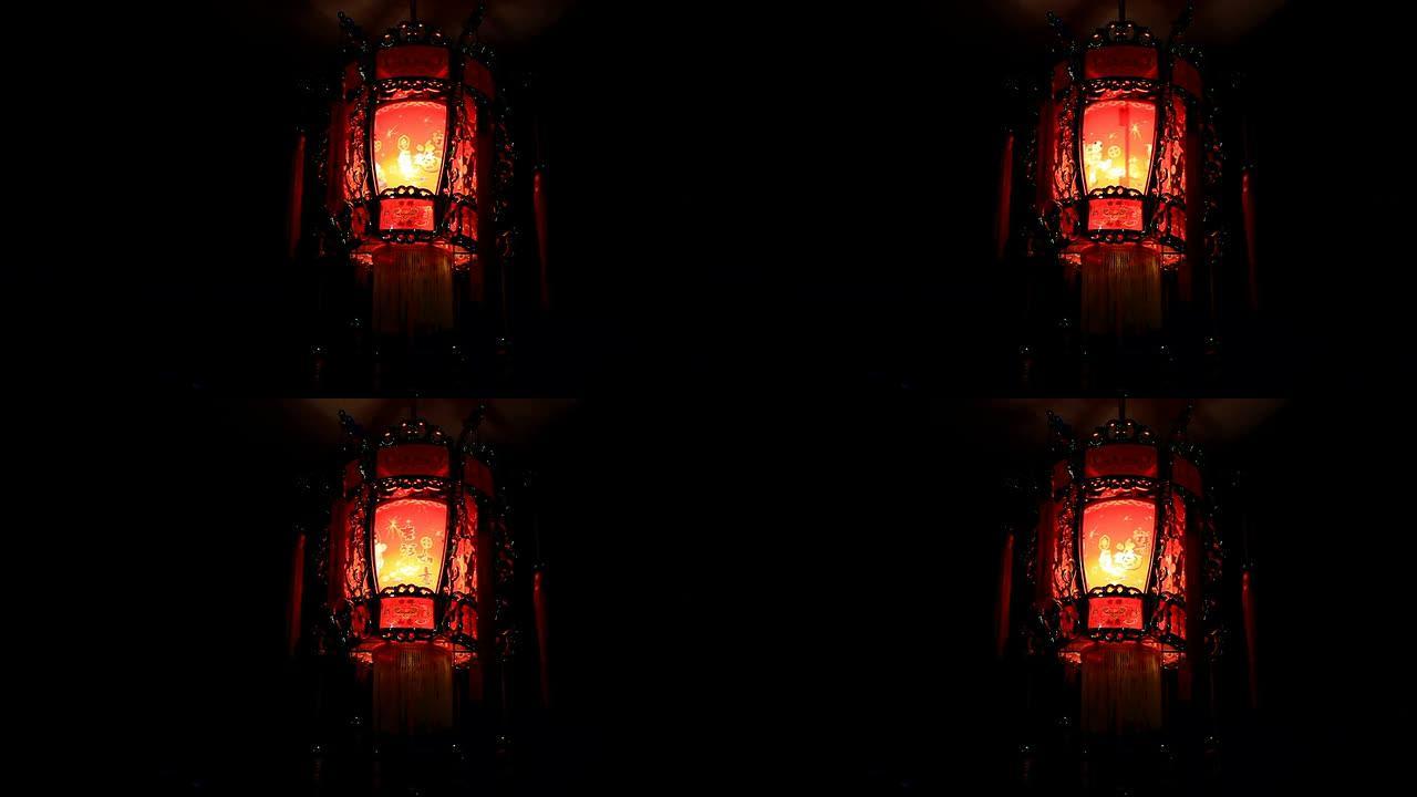 中国红灯笼在黑暗中旋转发光