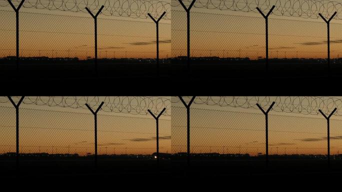 夜晚的慕尼黑机场铁丝网防护栏傍晚黄昏晚霞