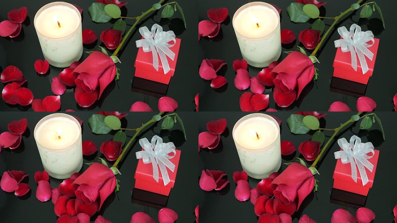 红玫瑰，玫瑰花瓣，礼品盒，情人节蜡烛。