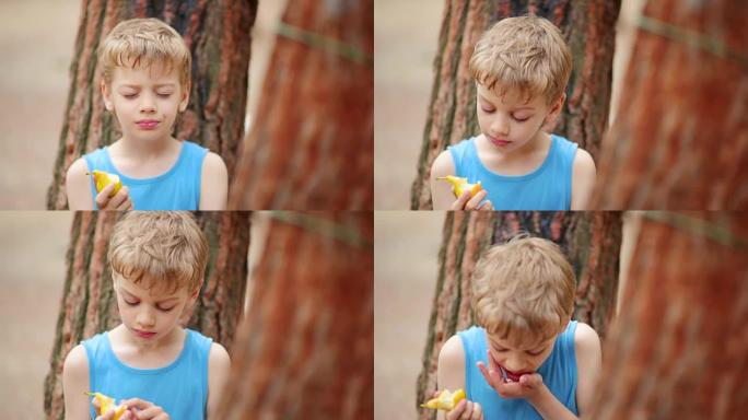男孩吃梨，特写