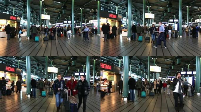 高清：旅行者在荷兰阿姆斯特丹机场候机楼散步