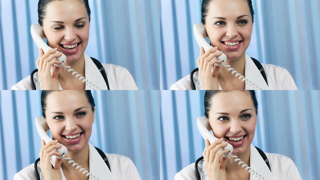快乐微笑快乐年轻女医生在办公室打电话