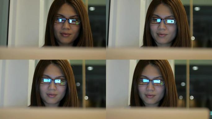 4k(UHD)，带眼镜的女商人在家里工作和使用笔记本电脑的特写镜头