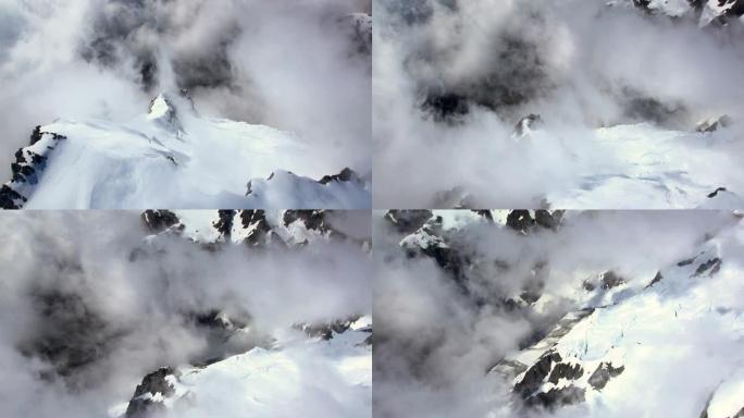 高空摄影盘旋在高山和云中的冰川上