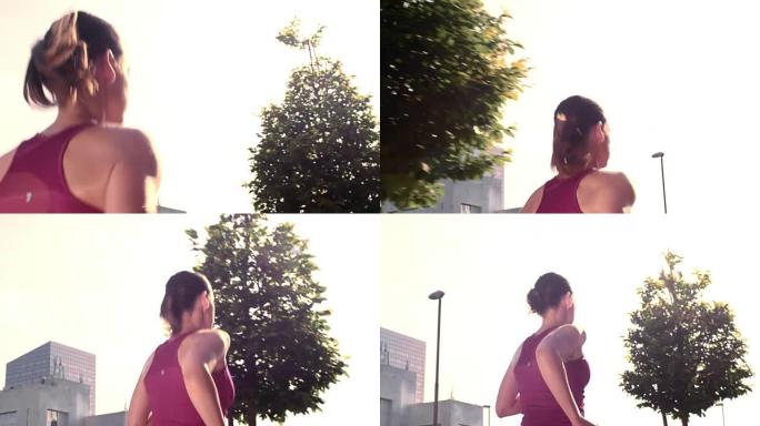 SLO MO TS女性在阳光下在城市中奔跑