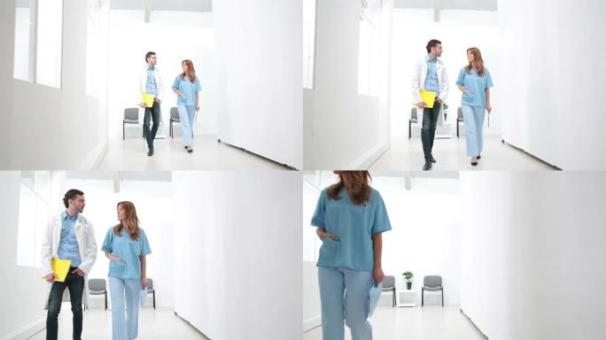 高清: 医生和护士走在医院走廊。