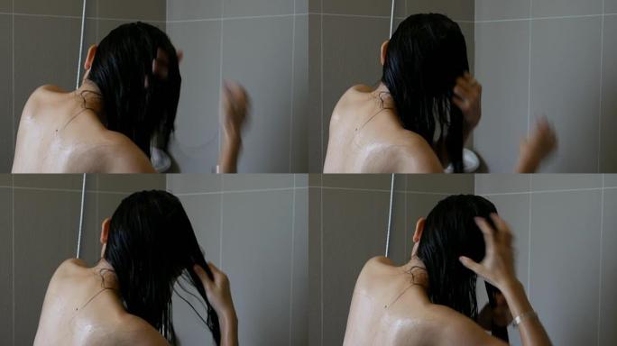 一位年轻美丽的亚洲妇女正在洗头