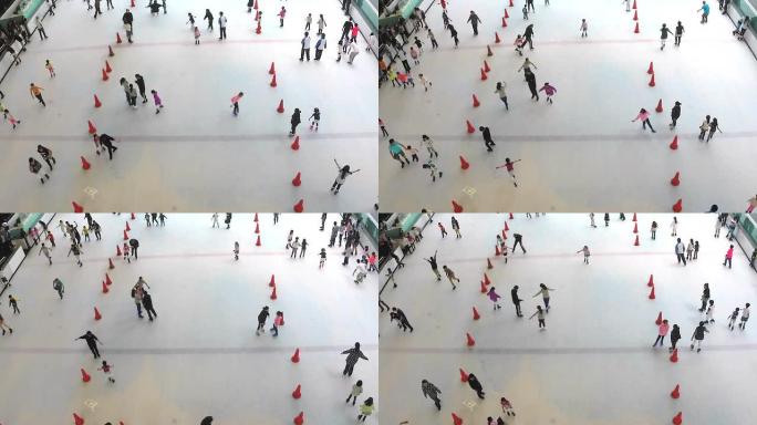 高清：一群人在室内溜冰场滑冰。（时间推移）