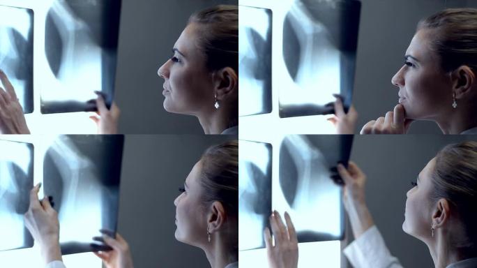 年轻漂亮的女医生检查x光照片。