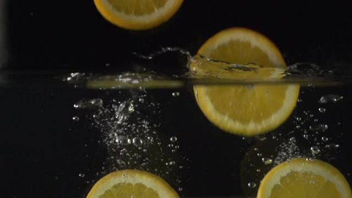 超慢动作：橙子/柠檬片落入水中