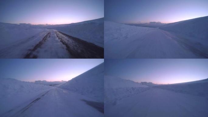 黄昏时分雪地冬季公路行驶