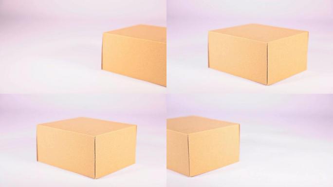 高清多莉: 白色背景上的棕色纸盒。