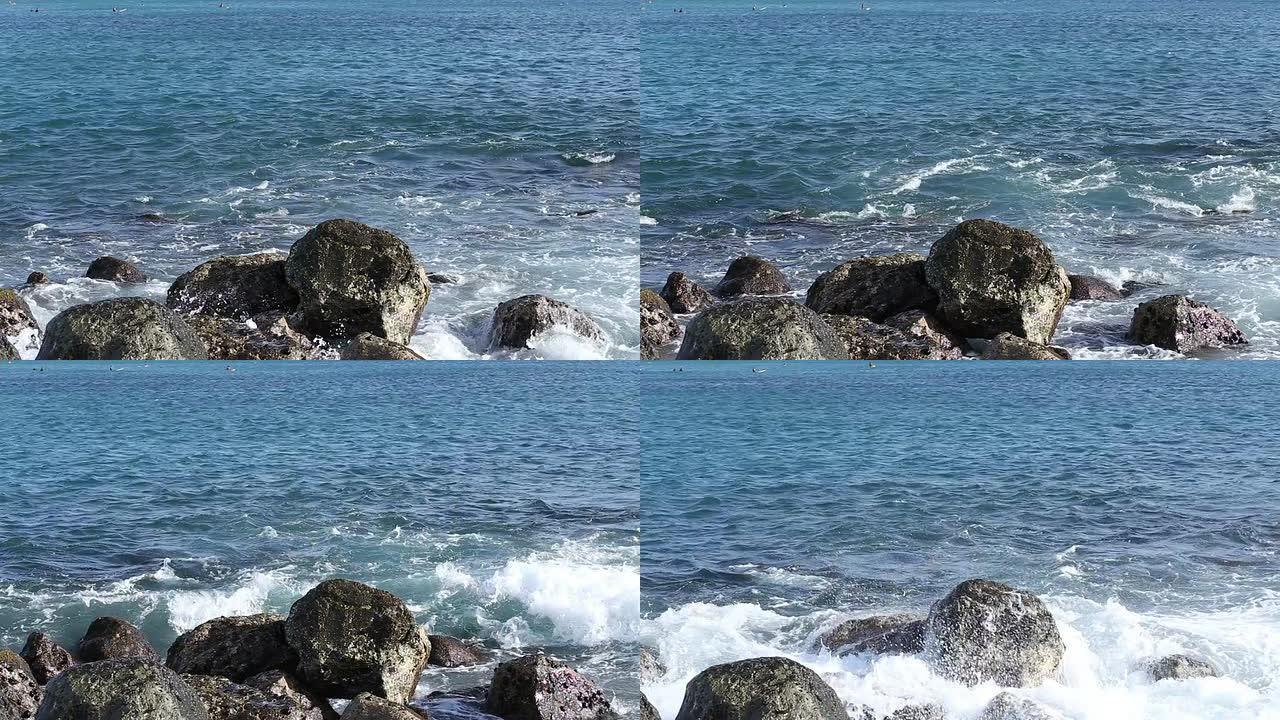 海浪拍打着岩石潮汐海浪海潮自然的力量特写
