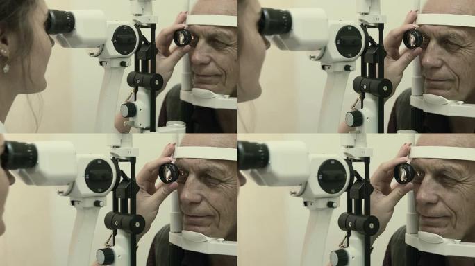 Optometrist examines man's eyesight