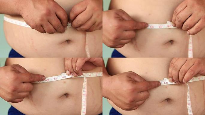 带着卷尺的大肚子胖子