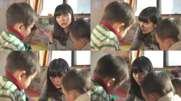 亚洲幼儿教师在教室里教孩子