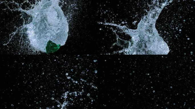 充满水的绿色气球SLO MO爆炸