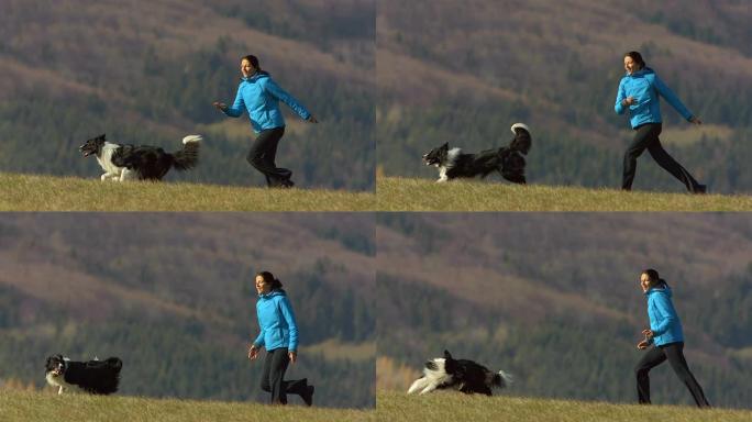 高清超级慢动作: 年轻女子和她的狗一起跑步