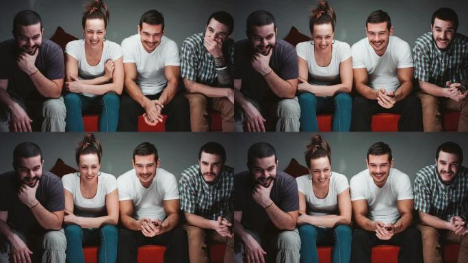 四个看电视的年轻人