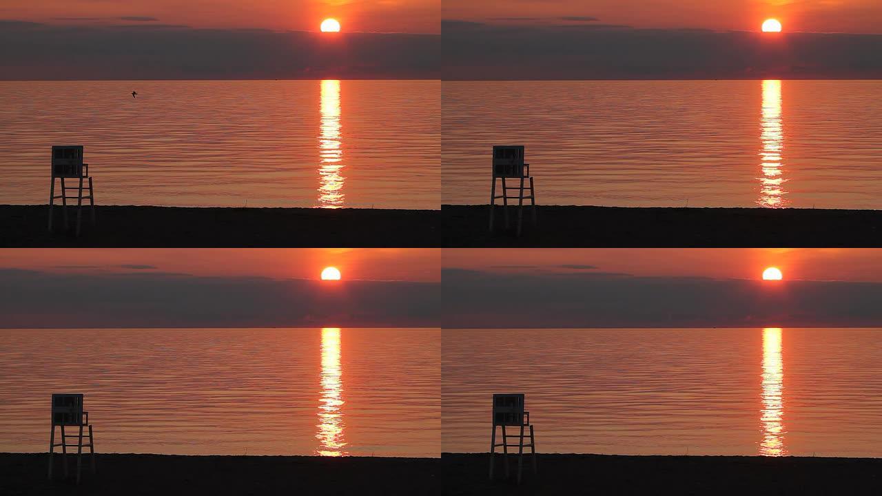 自然背景海洋橙色日落救生椅