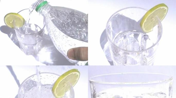 玻璃中的气泡水柠檬水夏日冰饮倒水