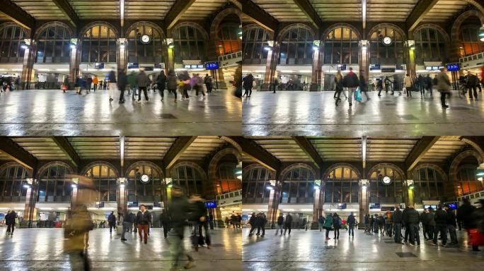 高清延时倾斜: 阿姆斯特丹车站夜晚的行人
