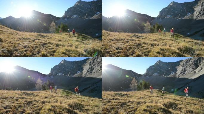 妇女徒步穿越山地草地