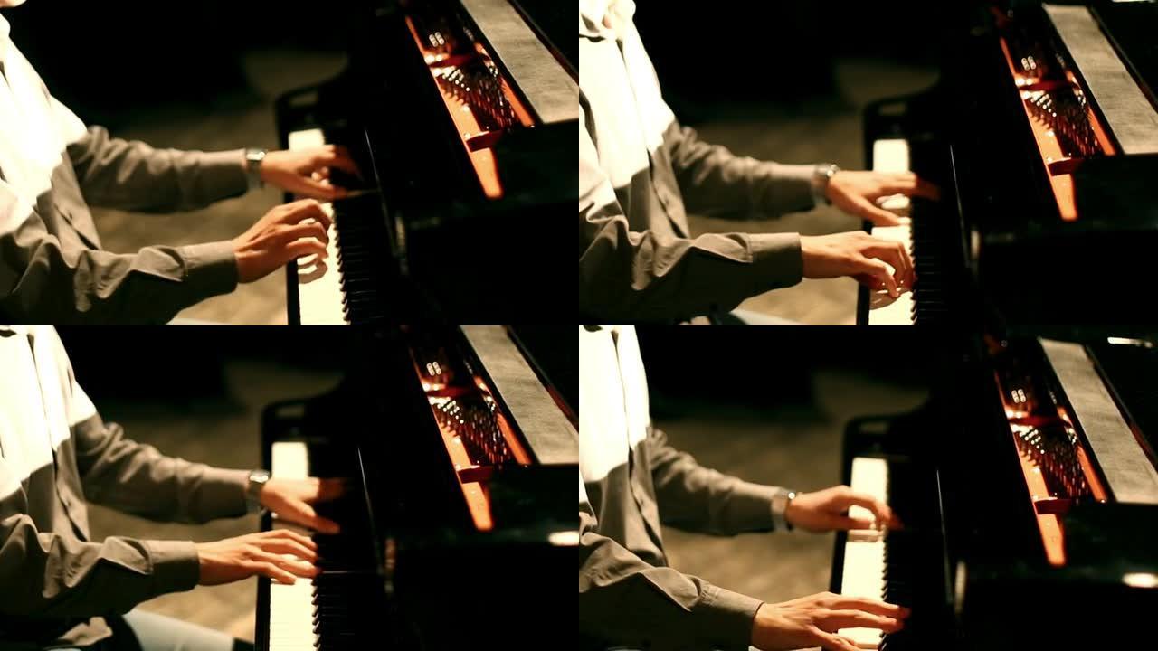 男人在弹钢琴。弹奏钢琴的手指