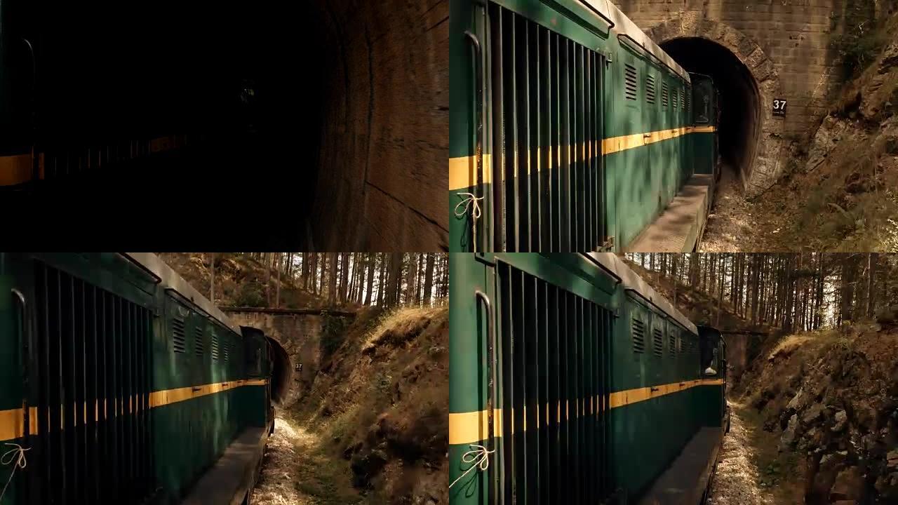 通过隧道和山区景观的火车-窄轨铁路
