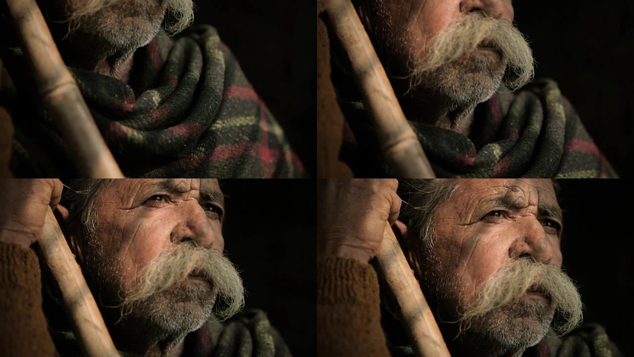 大胡子手持竹签的老人肖像。