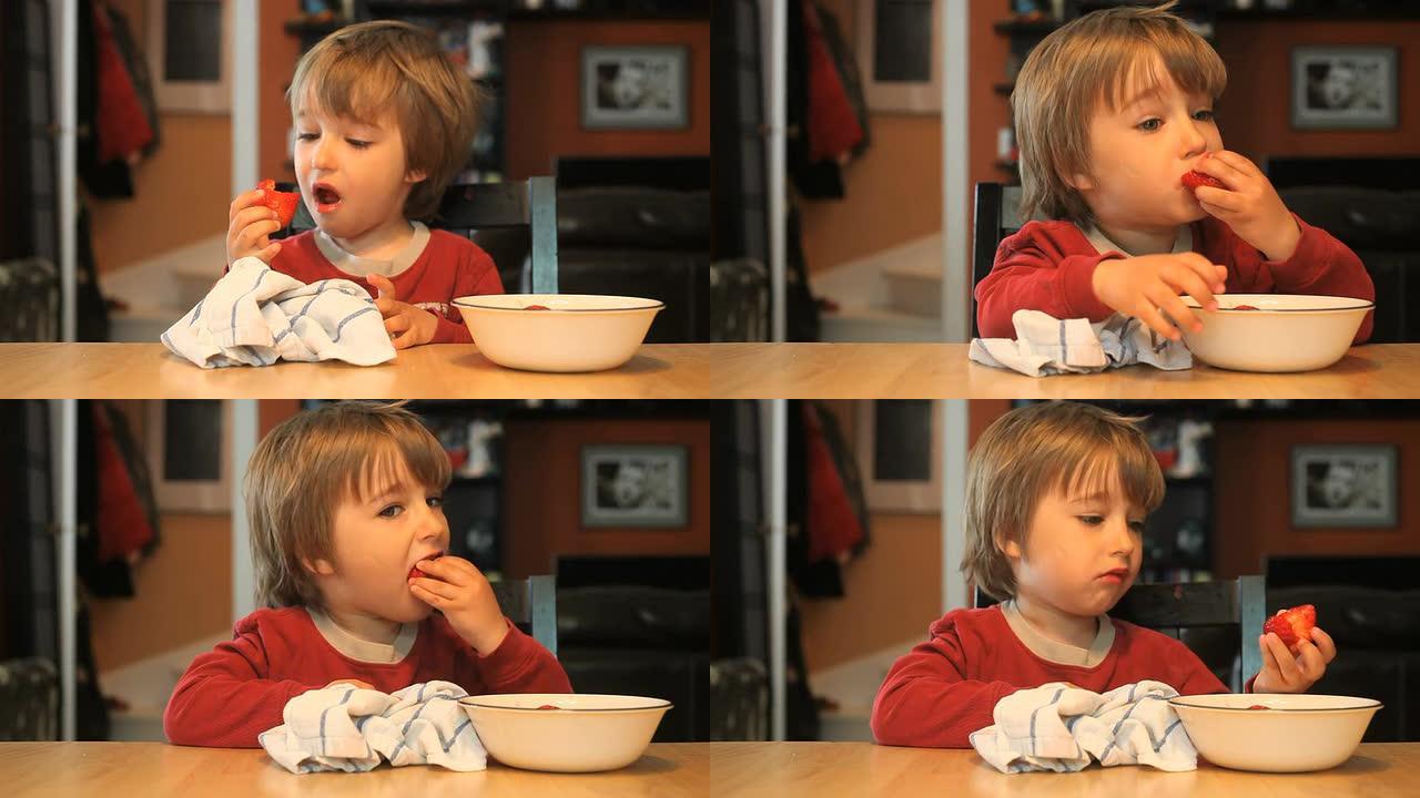 男孩在吃草莓吃草莓