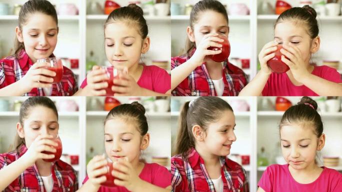 美丽的小女孩喝草莓冰沙