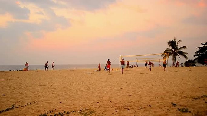 日落海滩上的延时排球