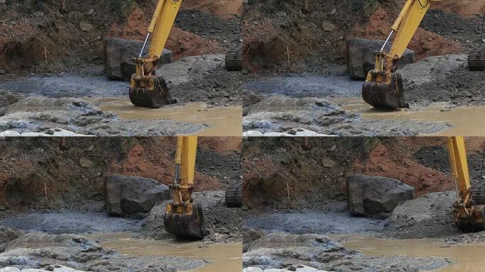 挖掘机在工作建设施工工地疏通河道特写镜头