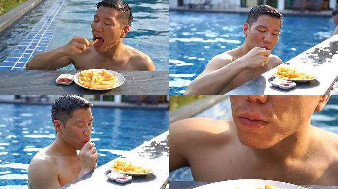 CU饥饿男子游泳后吃炸薯条