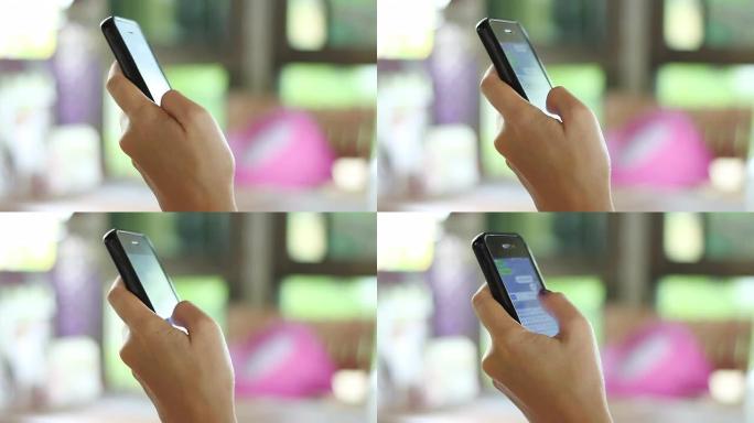 使用移动智能手机的双手特写