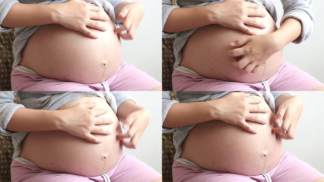 孕妇摸着肚子孕期妇女女人临产大肚子