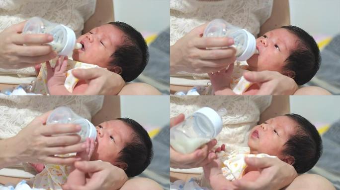 母亲怀抱的婴儿实拍视频素材喂奶幼儿
