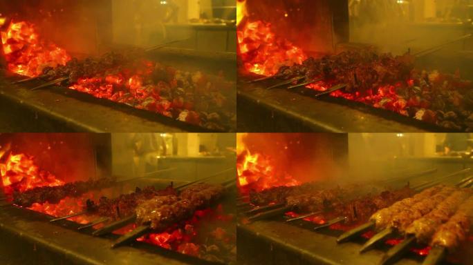高清: 壁炉框架背景中烧烤中的木炭燃烧。