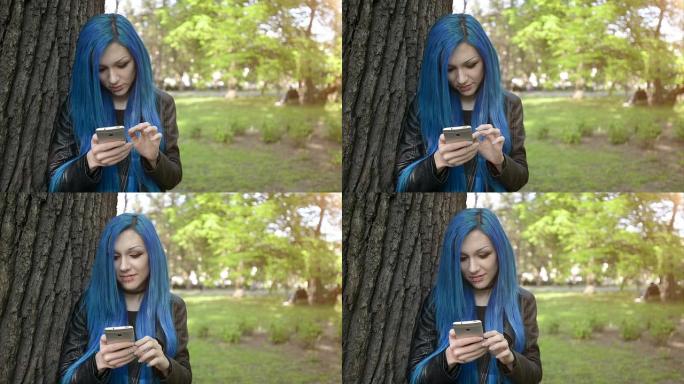 蓝头发女孩使用智能手机