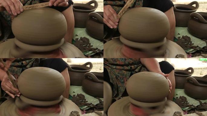 在陶工的轮子上制作陶罐