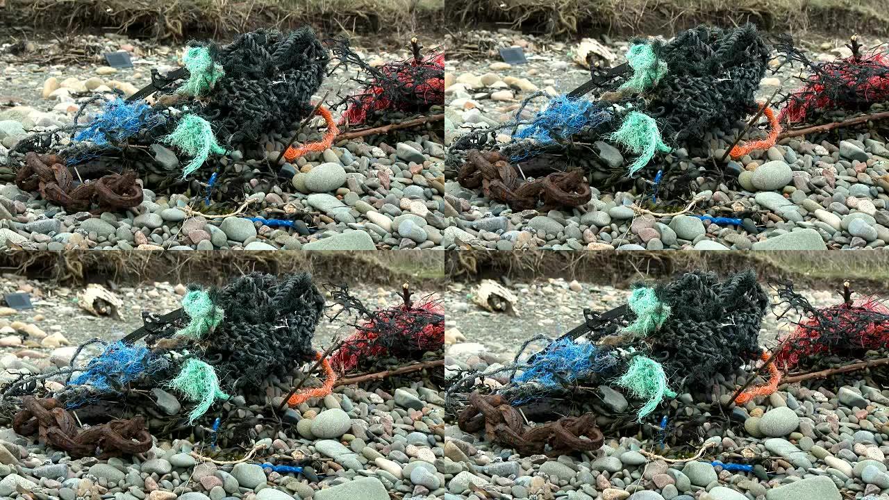 在苏格兰海滩上冲刷的渔网和碎屑