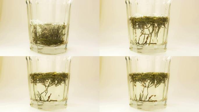 浸泡在玻璃杯中的中国绿茶。