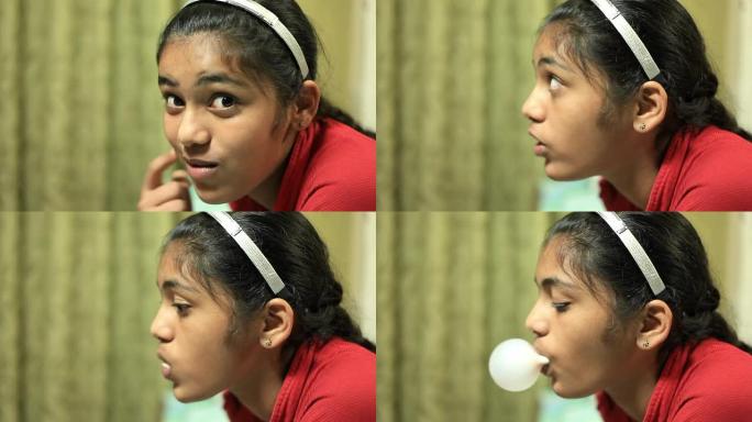 随意的印度少女吹泡泡糖