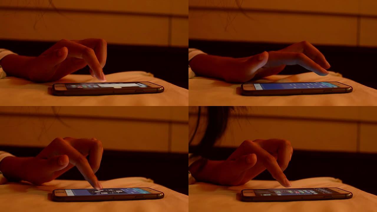 年轻女子在床上使用智能手机