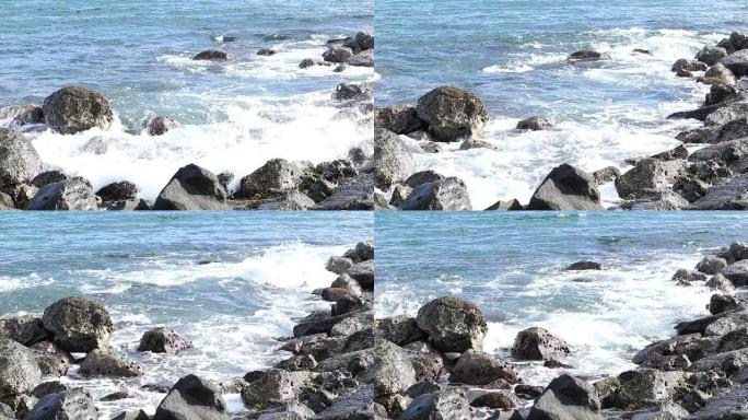 海浪拍打着岩石浪花大海