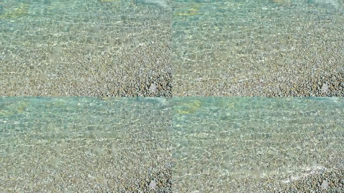 近岸透明海床水面鹅卵石涟漪