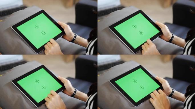 空白绿色屏幕平板电脑用手滑动特写