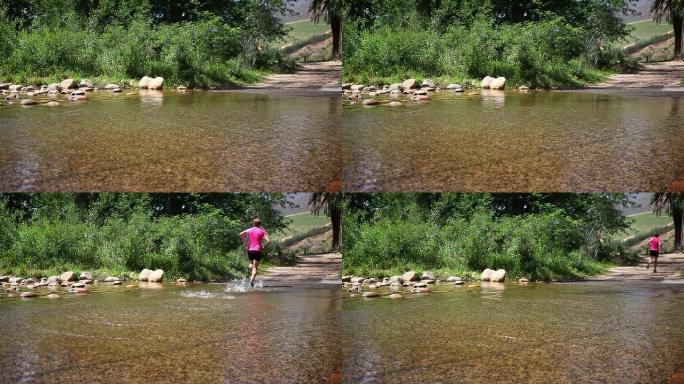 美丽的女跑步者穿过河流